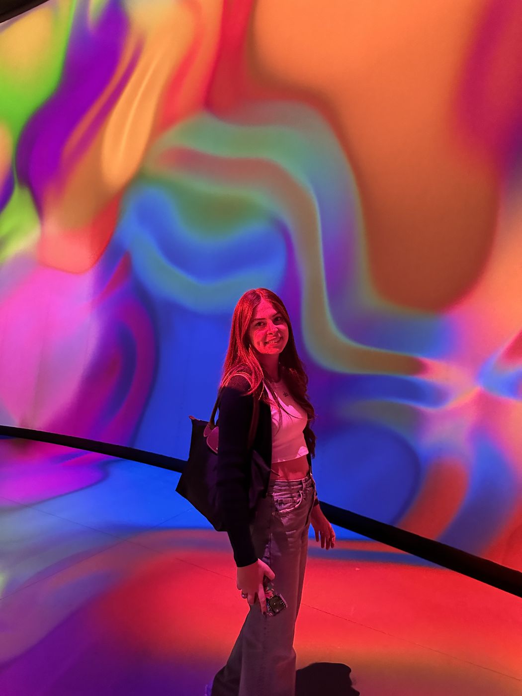 Zeynep in a colorful light installation